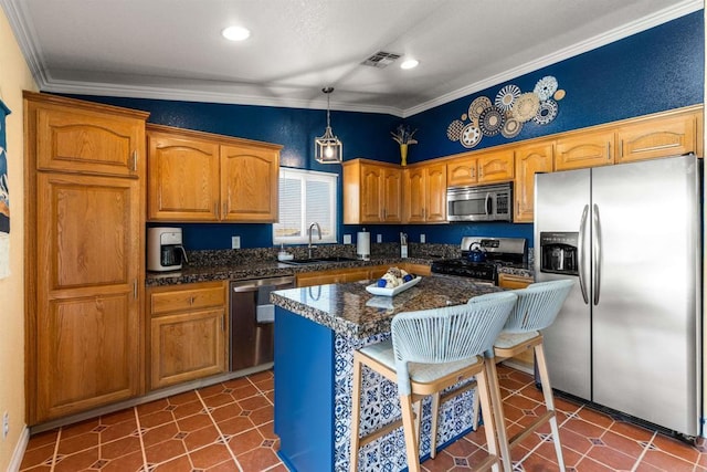 6636 Indian Cove Rd Unit 29, Palms, CA 92277 - kitchen featuring appliances with stainless steel finishes, dark countertops, crown molding, recessed lighting, and hanging light fixtures