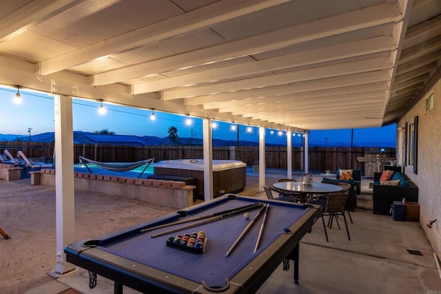 6636 Indian Cove Rd Unit 29, Palms, CA 92277 - fenced backyard featuring a hot tub, a patio, and outdoor dining area