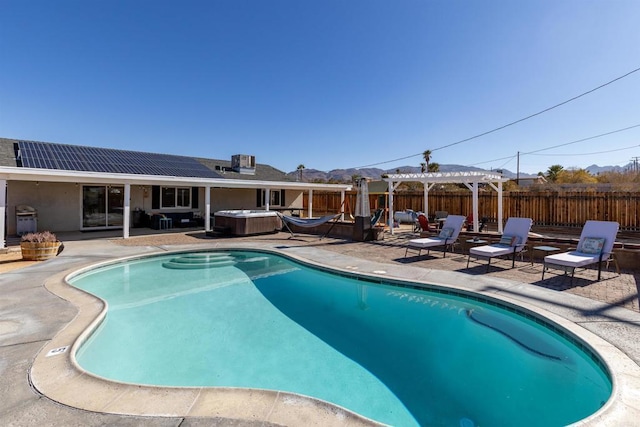 6636 Indian Cove Rd Unit 29, Palms, CA 92277 - view of pool featuring a hot tub, a pergola, a patio, and a mountain view