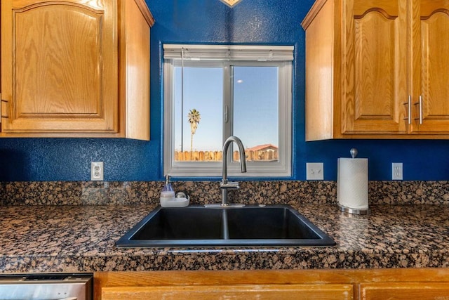 6636 Indian Cove Rd Unit 29, Palms, CA 92277 - kitchen with dark countertops and brown cabinets