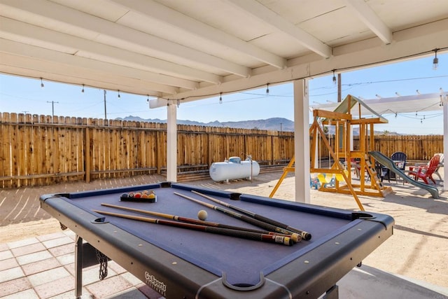 6636 Indian Cove Rd Unit 29, Palms, CA 92277 - recreation room with billiards table, a mountain view, and beam ceiling