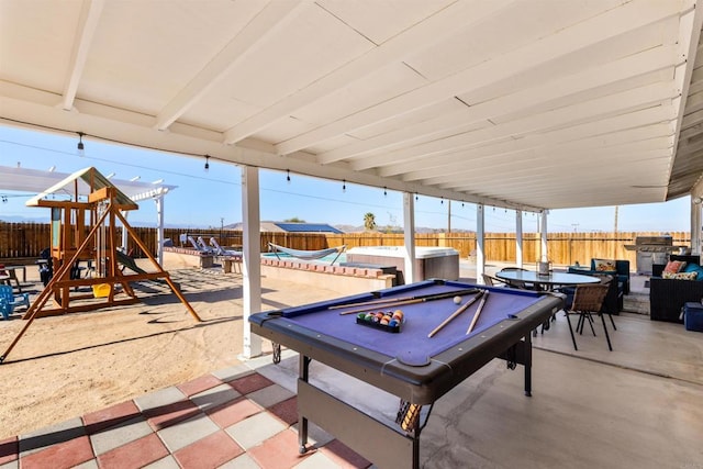 6636 Indian Cove Rd Unit 29, Palms, CA 92277 - fenced backyard with a pool, a patio, and outdoor dining area