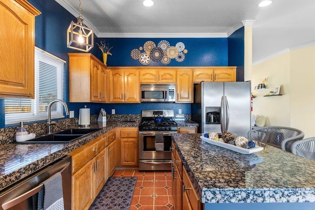 6636 Indian Cove Rd Unit 29, Palms, CA 92277 - kitchen with stainless steel appliances, dark countertops, crown molding, a kitchen island, and hanging light fixtures