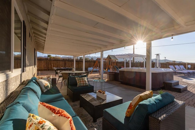 6636 Indian Cove Rd Unit 29, Palms, CA 92277 - fenced backyard featuring a hot tub, an outdoor living space, a patio area, and outdoor dining space