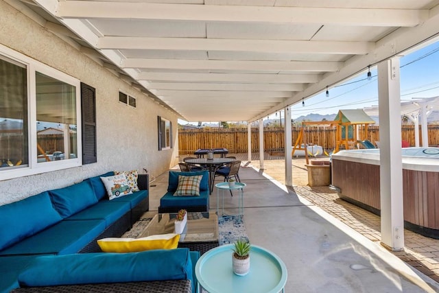 6636 Indian Cove Rd Unit 29, Palms, CA 92277 - fenced backyard featuring an outdoor hangout area, outdoor dining space, a playground, and a patio