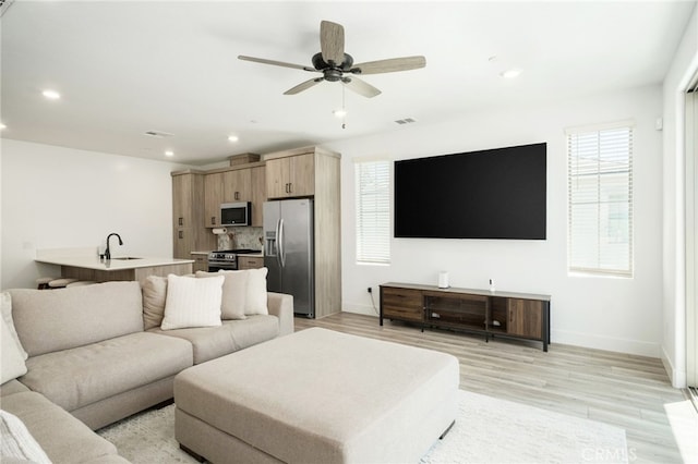 480 W Balsam Ln, Clovis, CA 93611 - living area featuring light wood-style flooring, recessed lighting, and a ceiling fan