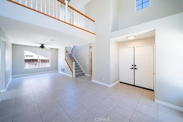26932 St Julian Cir, Murrieta, CA 92563 - tiled entrance foyer with stairs, a high ceiling, and a ceiling fan