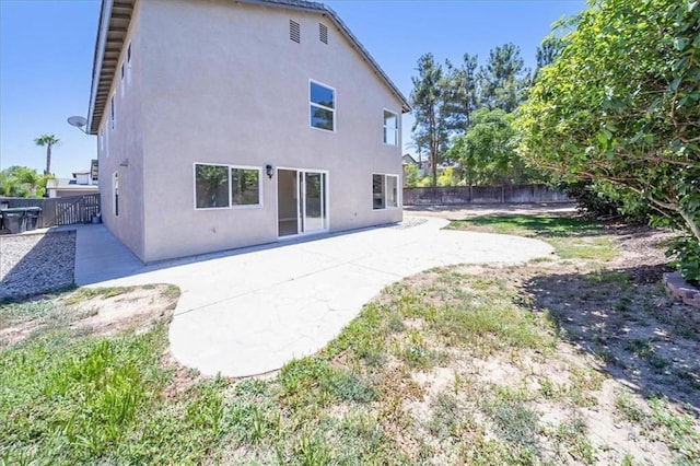 26932 St Julian Cir, Murrieta, CA 92563 - back of house featuring stucco siding, a fenced backyard, and a patio area