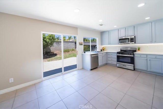 26932 St Julian Cir, Murrieta, CA 92563 - kitchen with appliances with stainless steel finishes, light countertops, recessed lighting, and light tile patterned floors
