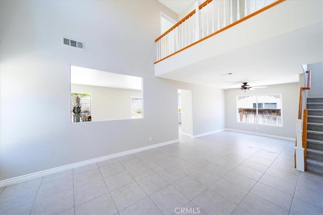 26932 St Julian Cir, Murrieta, CA 92563 - unfurnished living room with stairs, a high ceiling, a ceiling fan, and tile patterned floors