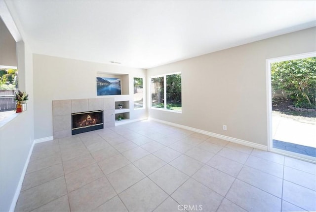 26932 St Julian Cir, Murrieta, CA 92563 - unfurnished living room with light tile patterned floors, built in features, and a tiled fireplace