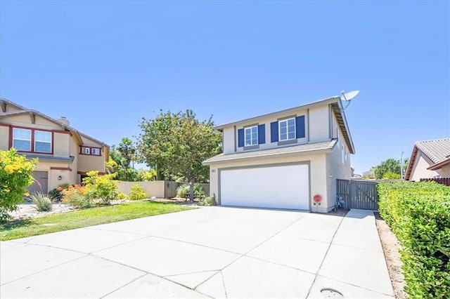 26932 St Julian Cir, Murrieta, CA 92563 - view of front of home with a garage, concrete driveway, and stucco siding
