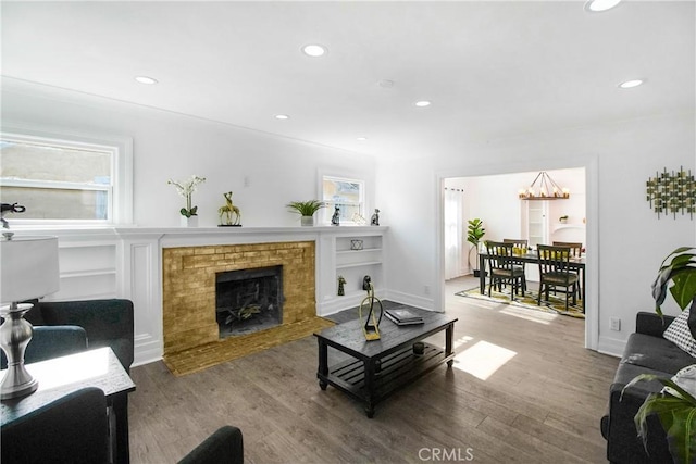 5737 5th, Los Angeles, CA 90043 - living area with a chandelier, wood finished floors, recessed lighting, and a fireplace