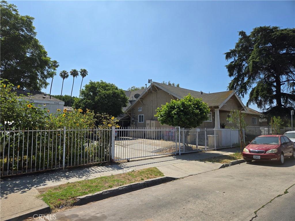 401 E 46th St, Los Angeles, CA 90011 - view of front of property featuring a fenced front yard and concrete driveway