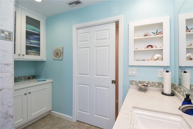 25355 Auld Ave, Hemet, CA 92544 - bathroom with vanity and tasteful backsplash
