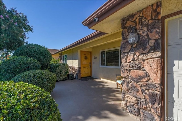 25355 Auld Ave, Hemet, CA 92544 - property entrance featuring stone siding and a patio area