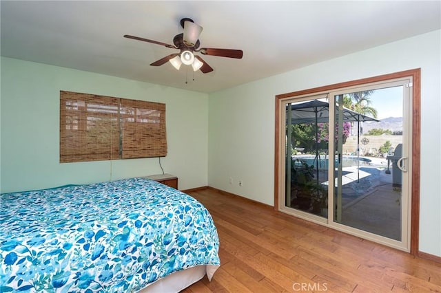 25355 Auld Ave, Hemet, CA 92544 - bedroom with access to exterior, wood finished floors, and a ceiling fan