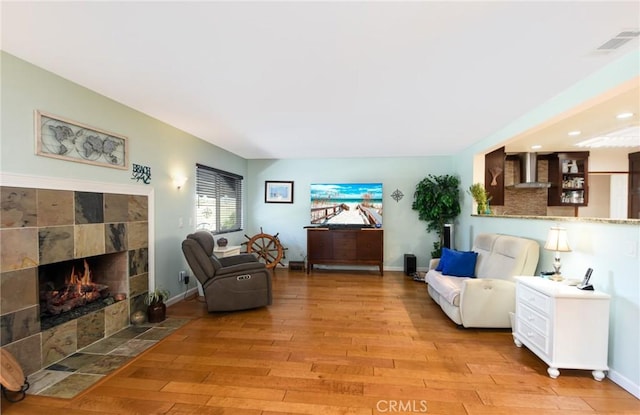 25355 Auld Ave, Hemet, CA 92544 - living area featuring light wood-style flooring, a fireplace, and recessed lighting