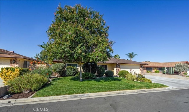 25355 Auld Ave, Hemet, CA 92544 - single story home featuring a garage, stone siding, driveway, and a front lawn