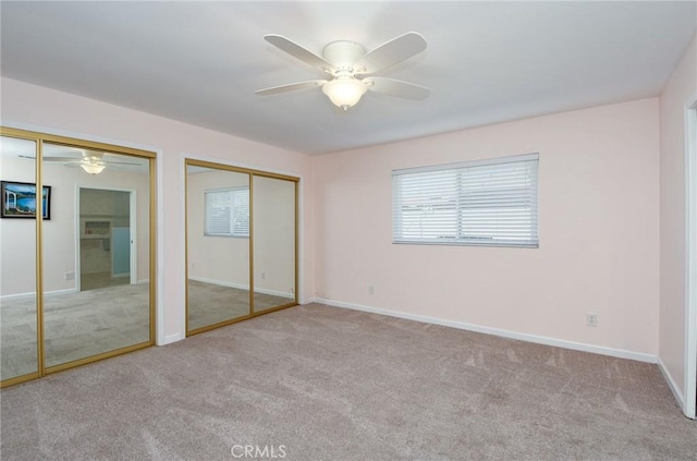 25355 Auld Ave, Hemet, CA 92544 - unfurnished bedroom featuring carpet floors, two closets, and ceiling fan