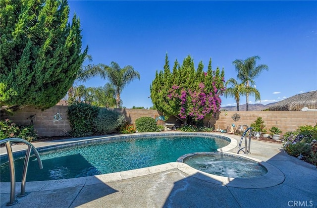 25355 Auld Ave, Hemet, CA 92544 - view of pool featuring a fenced backyard, a mountain view, a pool with connected hot tub, and a patio