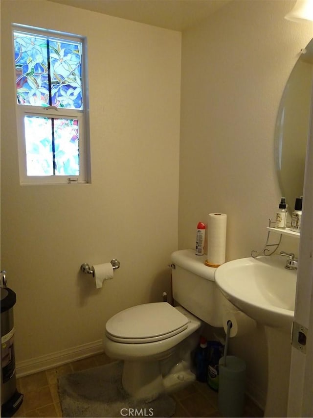 43890 Moccasin Pl, Lancaster, CA 93536 - half bath with toilet and tile patterned floors