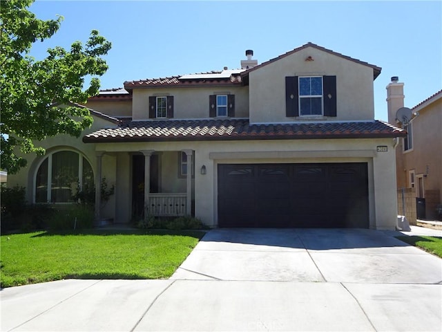 43890 Moccasin Pl, Lancaster, CA 93536 - mediterranean / spanish home featuring covered porch, concrete driveway, a front lawn, solar panels, and a tile roof