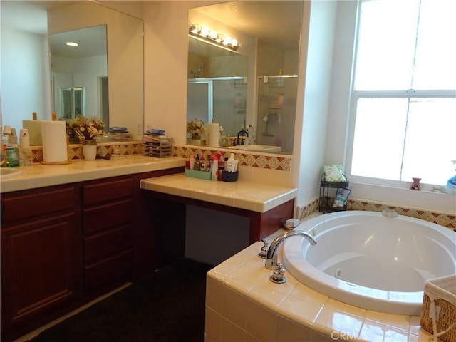 43890 Moccasin Pl, Lancaster, CA 93536 - full bathroom with a stall shower, a whirlpool tub, vanity, and tasteful backsplash