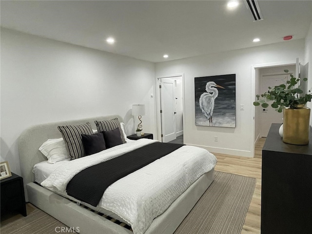 20406 Londelius St, Winnetka, CA 91306 - bedroom with light wood-style flooring and recessed lighting