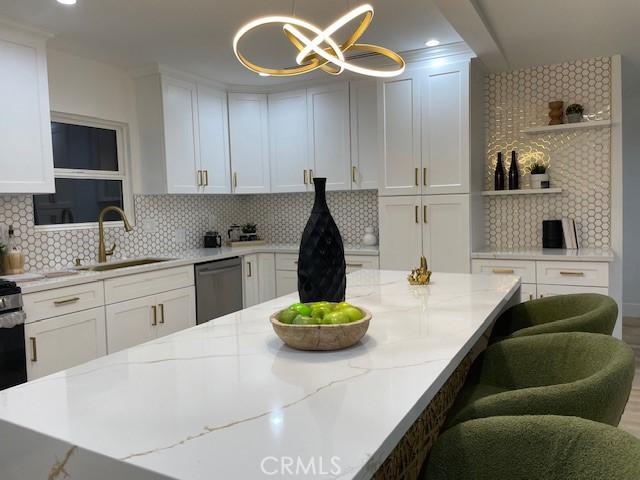 20406 Londelius St, Winnetka, CA 91306 - kitchen with dishwasher, open shelves, decorative backsplash, white cabinetry, and recessed lighting