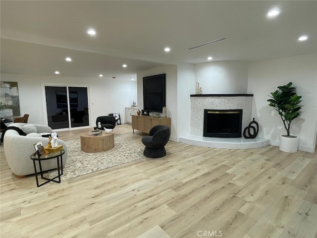 20406 Londelius St, Winnetka, CA 91306 - living area featuring recessed lighting, light wood-style floors, and a premium fireplace