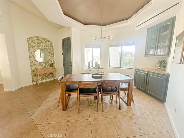7525 Whitney Ave, Yucca Valley, CA 92284 - dining room featuring a raised ceiling, a chandelier, and light tile patterned floors