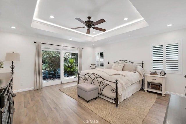 9604 Tunney Ave, Northridge, CA 91324 - bedroom featuring a tray ceiling, light wood-type flooring, recessed lighting, access to exterior, and ceiling fan
