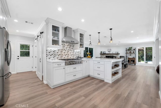 9604 Tunney Ave, Northridge, CA 91324 - kitchen featuring wall chimney range hood, appliances with stainless steel finishes, a peninsula, white cabinetry, and recessed lighting