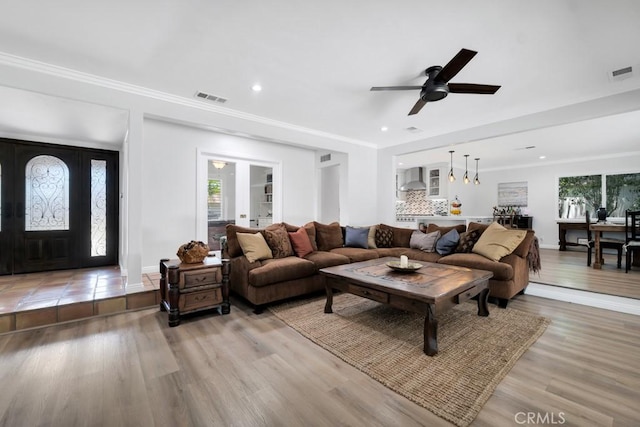 9604 Tunney Ave, Northridge, CA 91324 - living area featuring a ceiling fan, light wood-style floors, ornamental molding, and recessed lighting