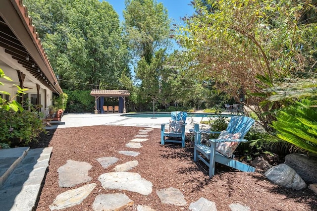 9604 Tunney Ave, Northridge, CA 91324 - view of yard with a patio area, an outdoor pool, and a ceiling fan