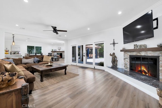 9604 Tunney Ave, Northridge, CA 91324 - living room with a fireplace, a ceiling fan, recessed lighting, wood finished floors, and crown molding