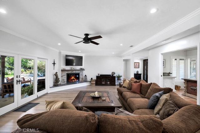 9604 Tunney Ave, Northridge, CA 91324 - living room featuring light wood-style flooring, a fireplace, ceiling fan, recessed lighting, and crown molding