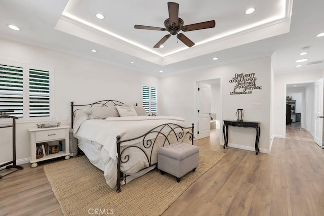 9604 Tunney Ave, Northridge, CA 91324 - bedroom with a tray ceiling, recessed lighting, light wood-type flooring, a ceiling fan, and multiple windows