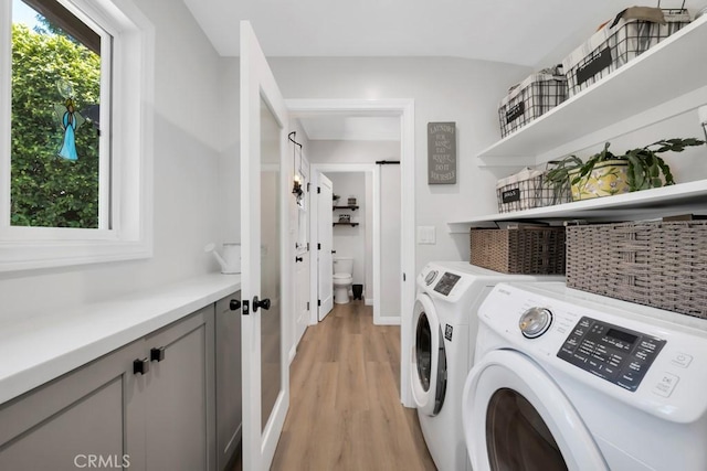 9604 Tunney Ave, Northridge, CA 91324 - laundry area with washer and dryer and light wood-style floors