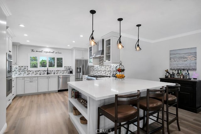 9604 Tunney Ave, Northridge, CA 91324 - kitchen with stainless steel appliances, wall chimney range hood, light countertops, decorative backsplash, and crown molding