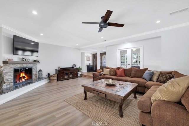 9604 Tunney Ave, Northridge, CA 91324 - living area featuring a fireplace, light wood finished floors, recessed lighting, crown molding, and ceiling fan