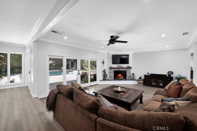 9604 Tunney Ave, Northridge, CA 91324 - living room featuring french doors, ornamental molding, wood finished floors, healthy amount of natural light, and a ceiling fan