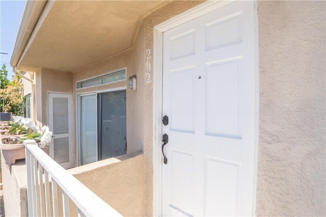 13801 Oxnard St Unit 202, Van Nuys, CA 91401 - doorway to property with stucco siding