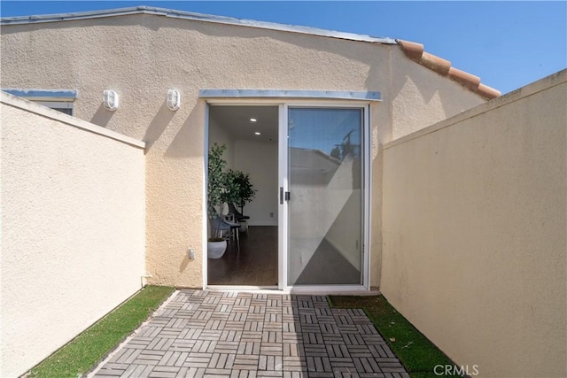 13801 Oxnard St Unit 202, Van Nuys, CA 91401 - property entrance featuring stucco siding and a patio area