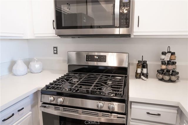13801 Oxnard St Unit 202, Van Nuys, CA 91401 - kitchen view of appliances with stainless steel finishes, white cabinetry, and light countertops
