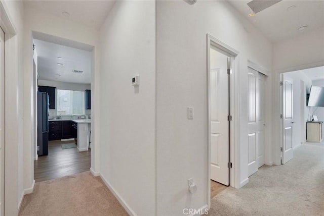 453 Daffodil Dr, Merced, CA 95341 - hallway with light colored carpet and baseboards