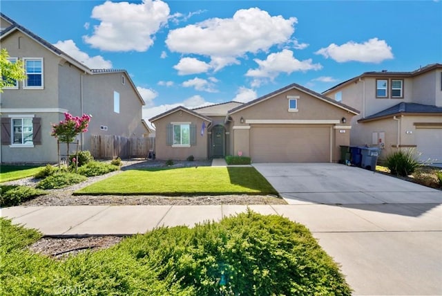 453 Daffodil Dr, Merced, CA 95341 - view of front of home with an attached garage, stucco siding, and concrete driveway