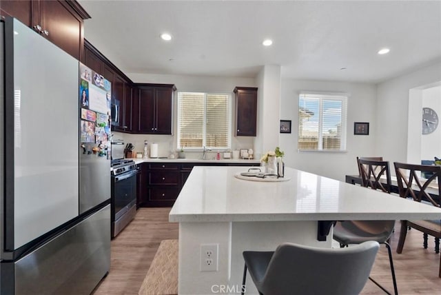 453 Daffodil Dr, Merced, CA 95341 - kitchen featuring stainless steel appliances, a center island, light wood-style flooring, light countertops, and recessed lighting