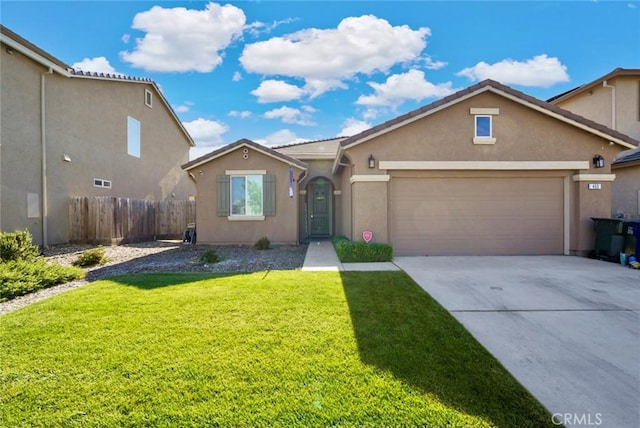 453 Daffodil Dr, Merced, CA 95341 - view of front facade with stucco siding, a garage, and concrete driveway